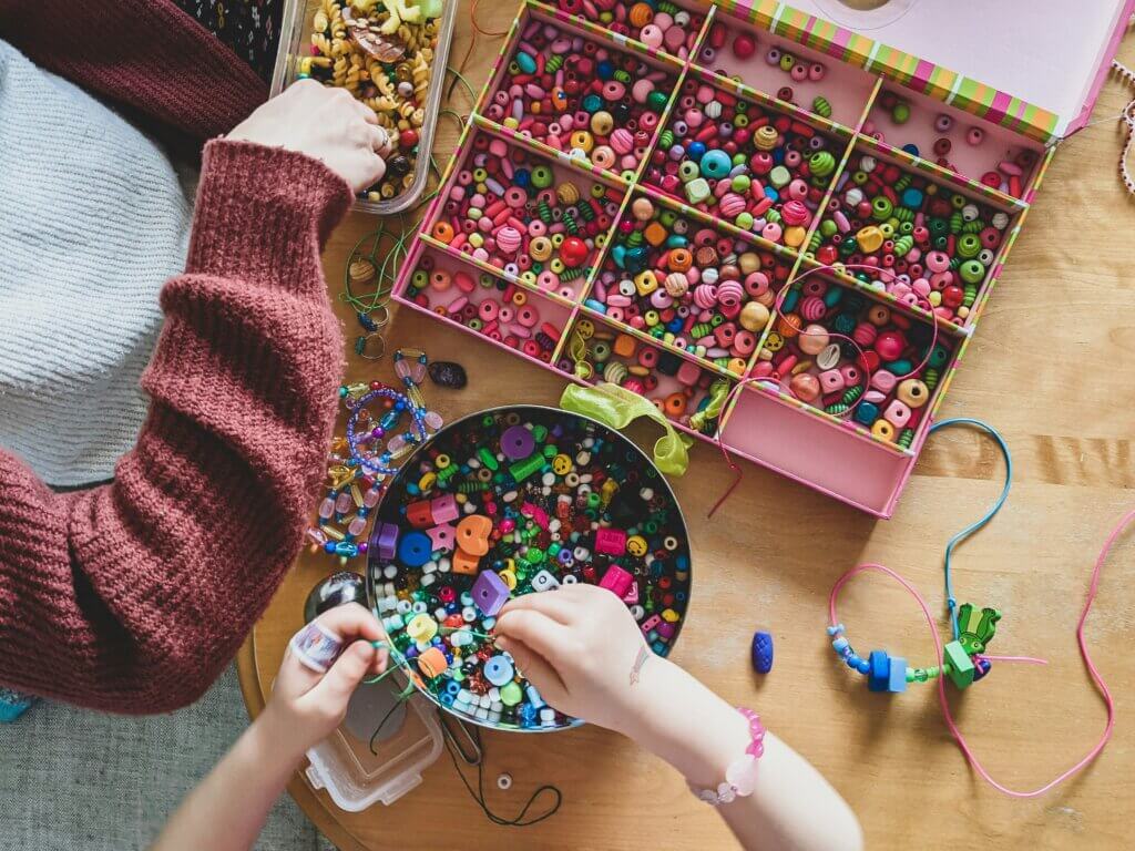 a woman and kid using must-have arts & crafts items they have