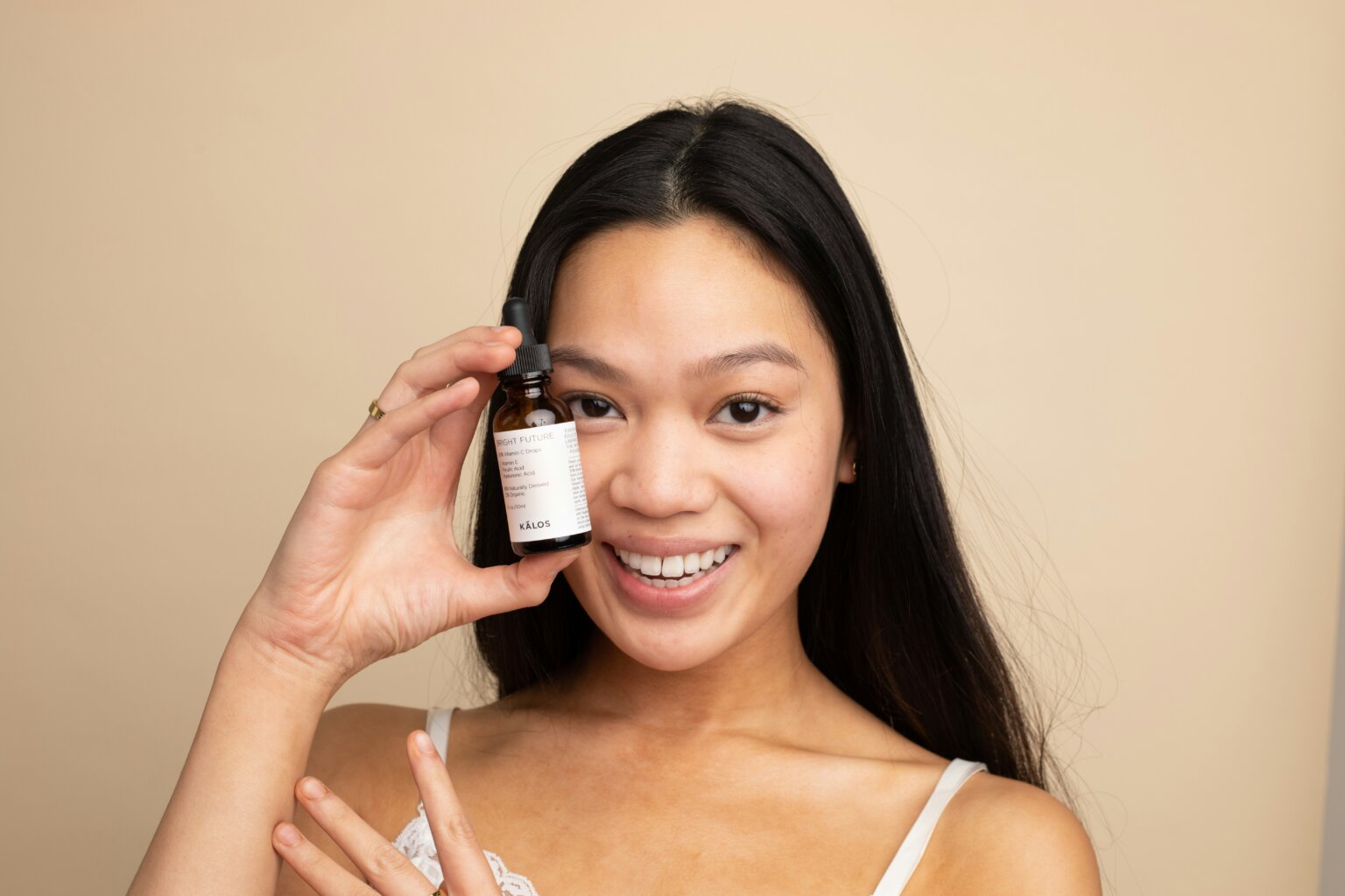 a girl holding up skincare