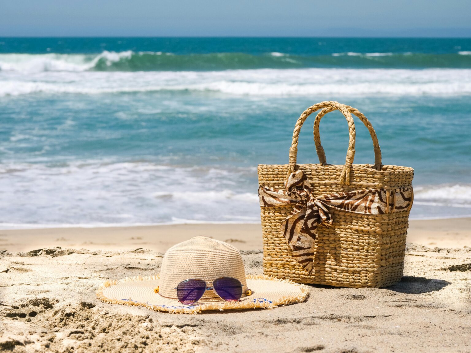 summer favorites a straw tote bag and straw sun hat